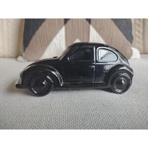 Vintage Avon Preshave Lotion bottle shaped like a black Volkswagen Beetle 1970s